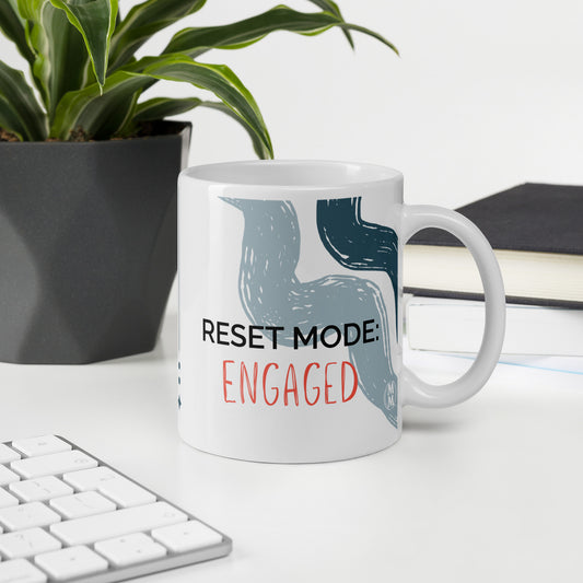 MoxieMart Reset Mode Engaged authority mug printed on both sides — white ceramic coffee cup with navy text