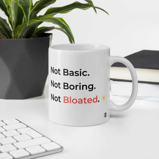 MoxieMart Not Basic Not Boring Not Bloated sassy mug — double-sided ceramic coffee cup with bold black and salmon text. - 11oz