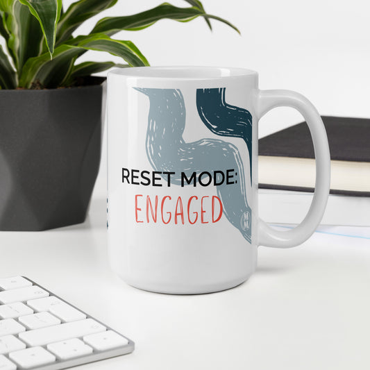 MoxieMart Reset Mode Engaged authority mug printed on both sides — white ceramic coffee cup with navy text
